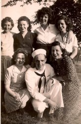 This is the day Norm Ouellette came home. His wife Mary clings to his arm while he's surrounded by his sisters, Pat, Bernie, Toni, Marie and their tall friend Dot. Detroit, 1944.
(ShorpyBlog, Member Gallery)